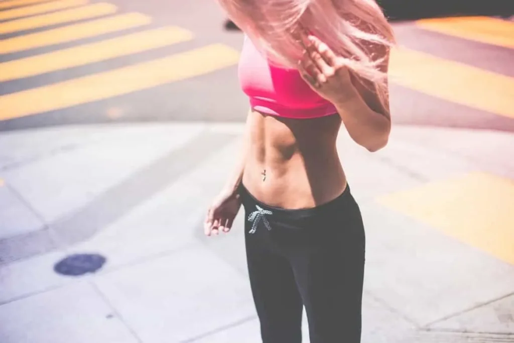 Woman with toned stomach after LA-EMS Body Sculpting Treatment West Barnes